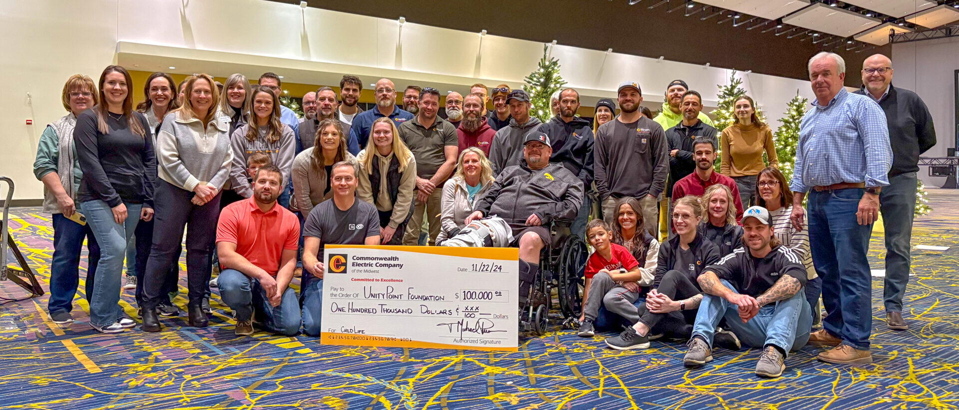 Commonwealth’s Des Moines team presents a check to the Child Life Program at UnityPoint Health – Blank Children’s Hospital.