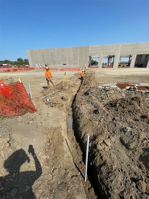 Commonwealth Employees working outside of the NMC Cat Dealership.