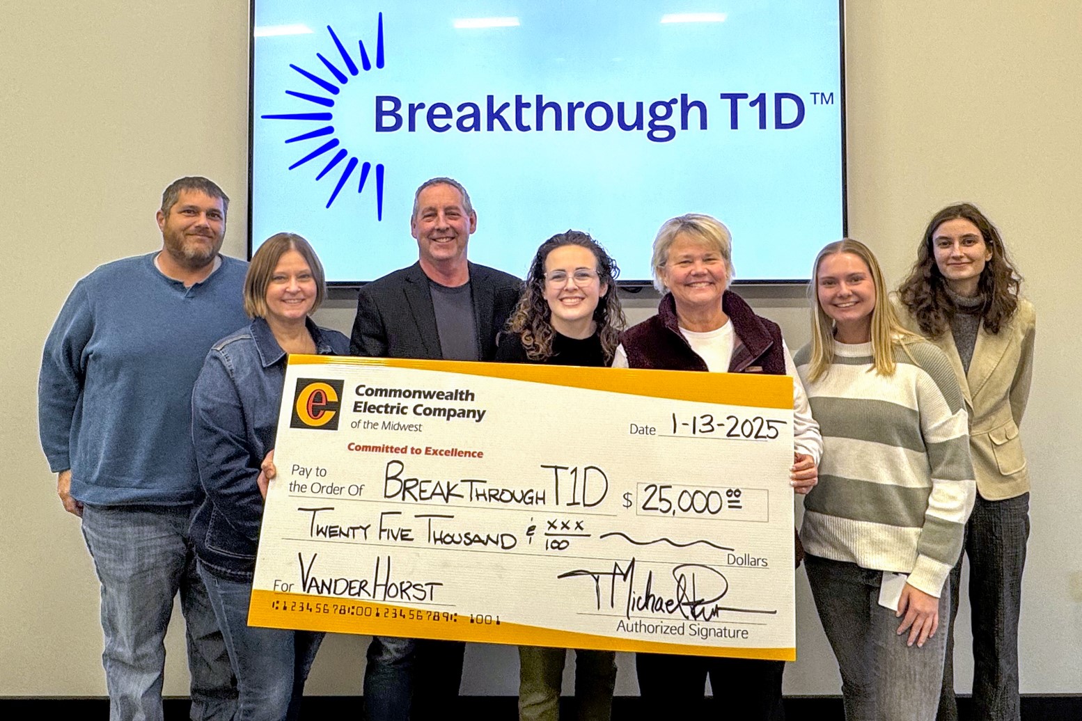 The Des Moines team presents a check to Breakthrough T1D.